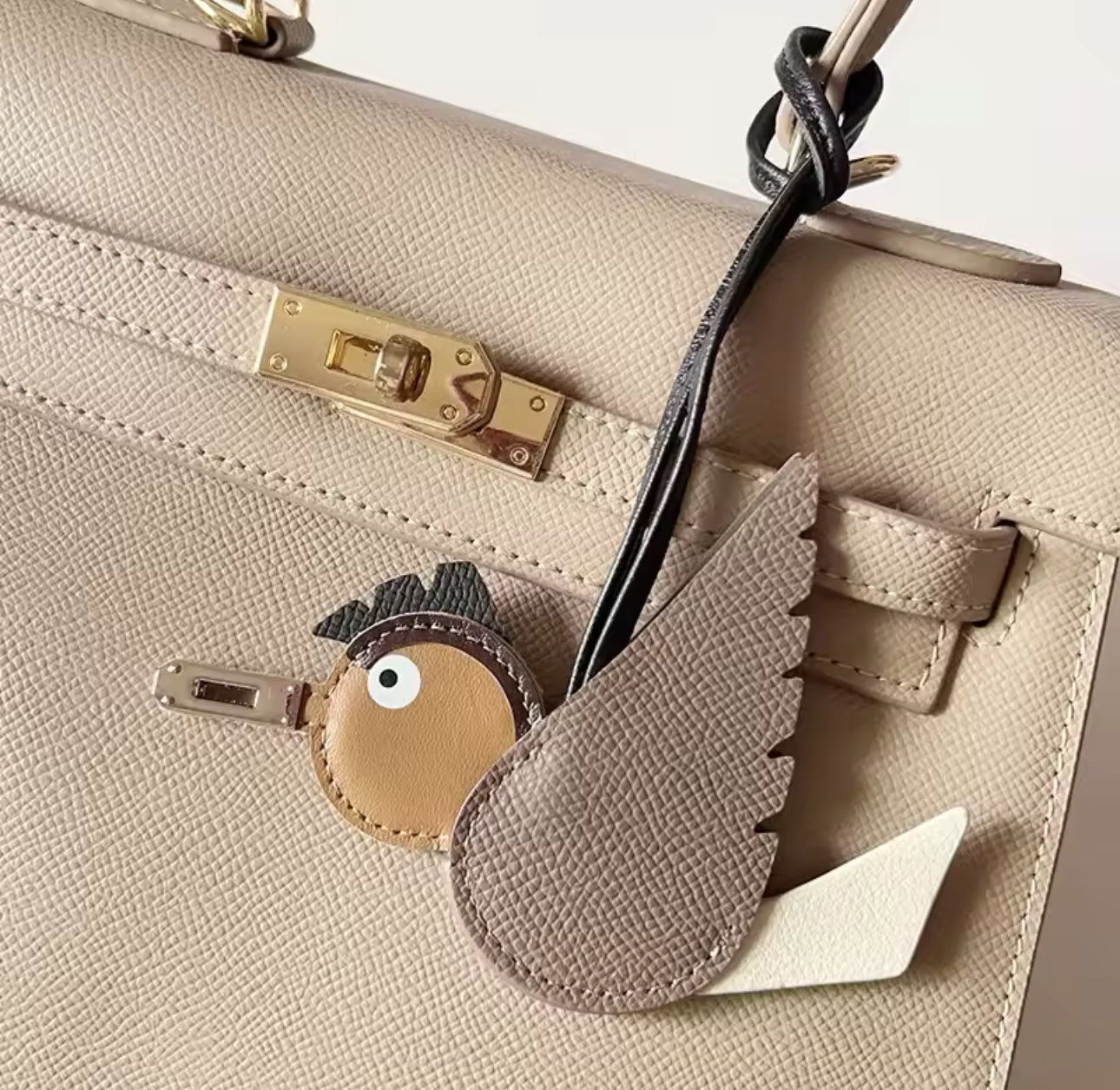 Beige bird charm