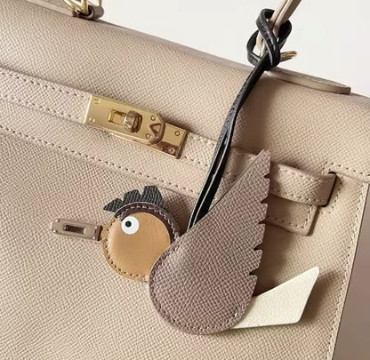 Beige bird charm